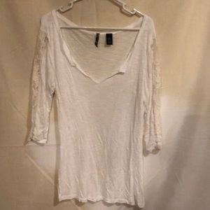 White shirt with lace sleeves.